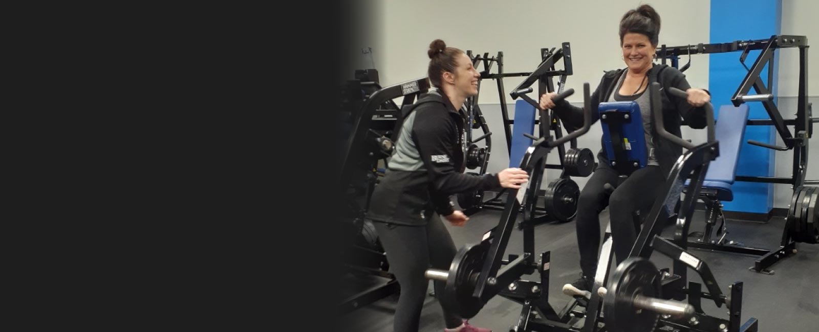 Personal trainer coaching a woman on an excercise bike - Train Hard Fitness  8180 Oswego Rd.  Liverpool, NY 13090  315-409-4764